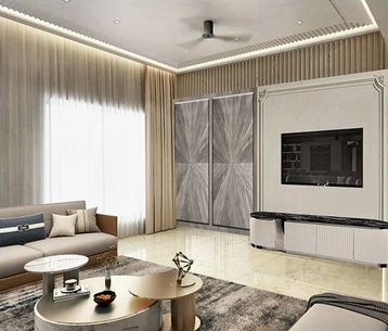 A television set into a panelled wall beside a pair of tall sliding screens, with a low sofa and round tables.